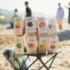 Www-Teas-Co-Uk-Good-Earth-Elderflower-And-Pear-White-Tea-15-Tea-Bags-18G-5000208052097-Our-Other-Teas-Avaliable-Lifestyle-Shot-At-Beach Good Earth Elderflower And Pear White Tea, 15 Tea Bags 18G