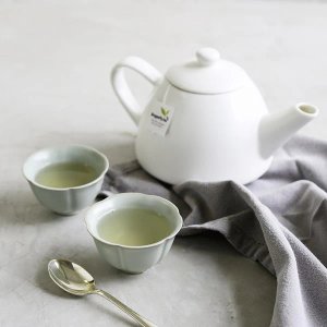 Dragonfly Organic Moroccan Mint 40 Tea Bags 80G Tea, brewing in white cup, available at teas.co.uk
