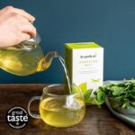 Dragonfly Organic Moroccan Mint 40 Tea Bags 80G Teapot Pouring, tea into clear glass cup, available at teas.co.uk