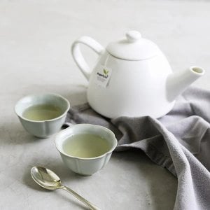Dragonfly Organic Pure Green Mountain 40 Tea Bags 80G Brewed, tea in white china cup, available at teas.co.uk