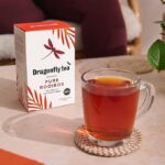 Dragonfly Organic Pure Rooibos, 40 Tea Bags 100g, lifestyle showing box and tea in clear glass cup, available at teas.co.uk