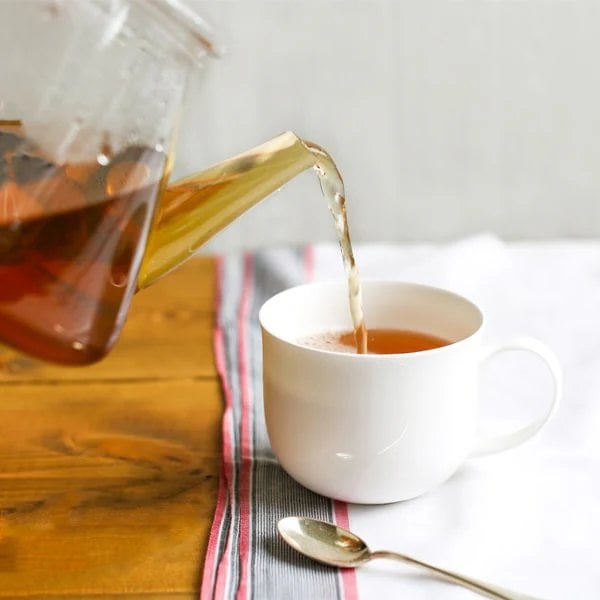 Dragonfly Organic Pure Rooibos, 40 Tea Bags 100G, Tea Being Poured Into White Cup, Available At Teas.co.uk