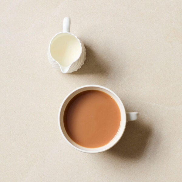 Williamson English Breakfast, 50 Tea Bags 125g, brewed cup of tea and small pot of milk top view, available at teas.co.uk