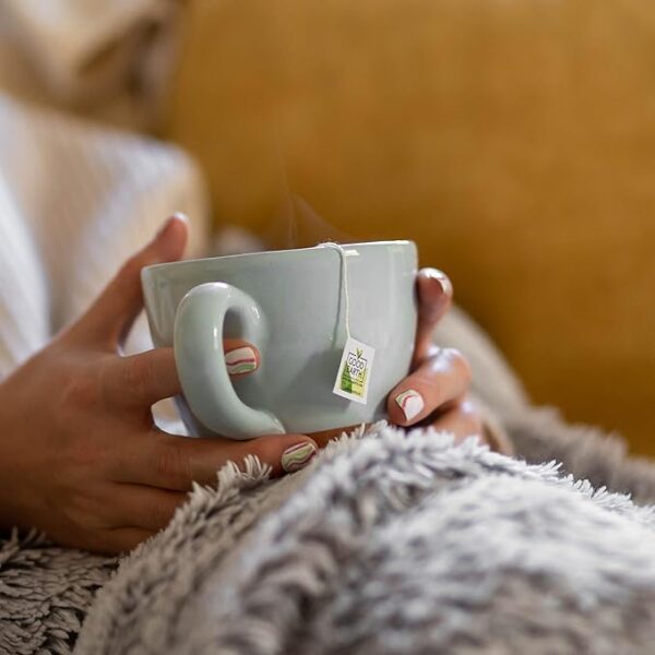 Good Earth Chamomile and Grapefruit, 15 Tea Bags 42g, lady holding tea in white cup, available at teas.co.uk