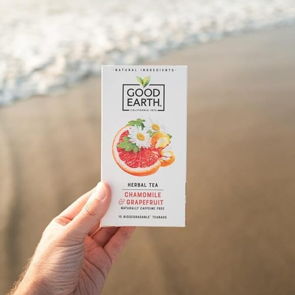 Good Earth Chamomile And Grapefruit, 15 Tea Bags 42G, Lifestyle Sh0T On A Sandy Beach With Sea Showing, Available At Teas.co.uk