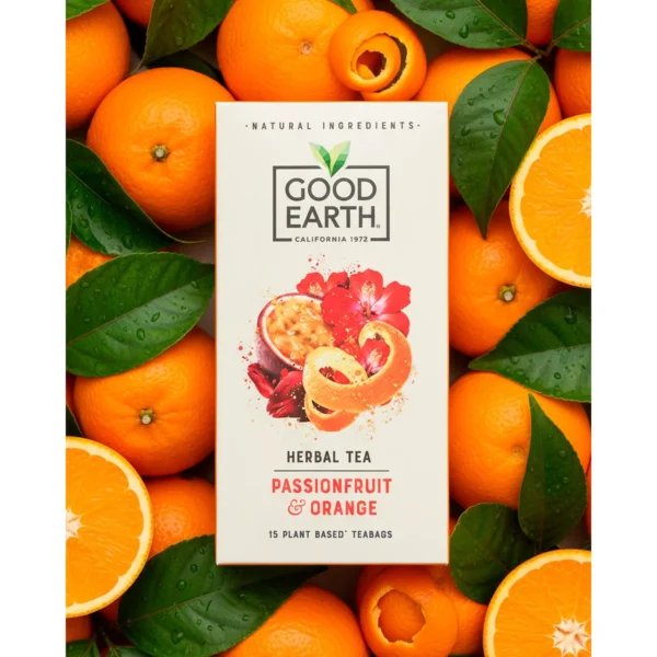 Good Earth Passionfruit and Orange, 15 Tea Bags 37.5g, front of box resting on oranges to emphasise the orange flavour, available at teas.co.uk