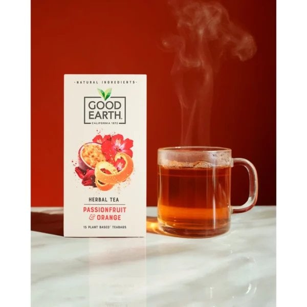 Good Earth Passionfruit And Orange, 15 Tea Bags 37.5G, Front Of Box With Brewed Tea In Clear Glass Cup, Available At Teas.co.uk