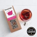 Teapigs Strawberry and Juniper, 15 Tea Bags 37.5g, box on table with brewing tea, available at teas.co.uk