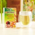 Twinings Gingerbread Green Tea, 20 Tea Bags 40g, front of box next to brewing tea, available at teas.co.uk