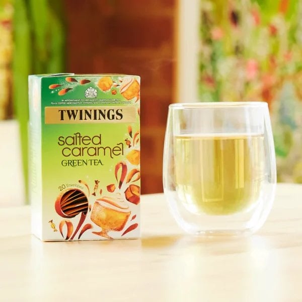 Twinings Salted Caramel Green Tea, 20 Tea Bags 40g, lifestyle showing box of tea and brewing cup of tea, available at teas.co.uk