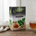 Dalgety Pure Moringa, 18 Tea Bags 40g, box on tabel with brewing tea, available at teas.co.uk