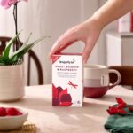 Dragonfly Organic Sweet Rosehip and Raspberry, 20 Tea Bags 34g, box on table with brewing mug, available at teas.co.uk