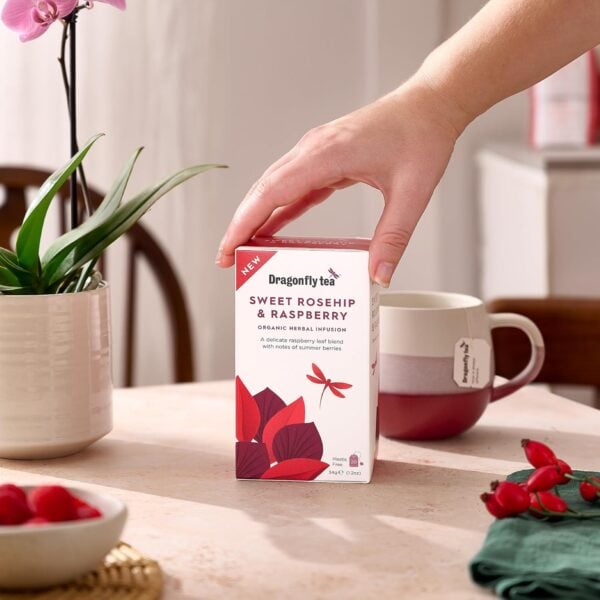 Dragonfly Organic Sweet Rosehip And Raspberry, 20 Tea Bags 34G, Box On Table With Brewing Mug, Available At Teas.co.uk