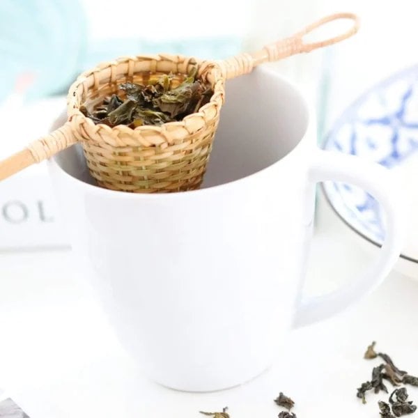 Pattiya Bamboo Tea Strainer Handmade In Thailand Tea, brewing in mug with tea leaves, available at teas.co.uk