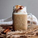 Starbucks Cinnamon Dolce Latte, 5 Sachets 117.5g, drink in glass mug with cream topping, available at teas.co.uk