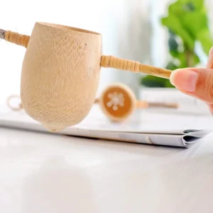 Tunta Bamboo Tea Strainer, Handmade in Thailand, close up in hand, available at teas.co.uk