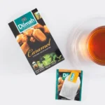 Dilmah Caramel Tea, 20 Tea Bags 30g, lifestyle showing tea brewing0with tea box, available at teas.co.uk