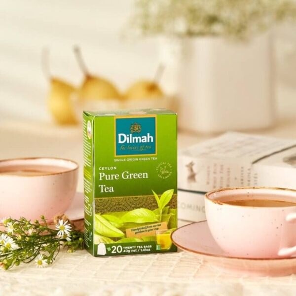 Dilmah Ceylon Pure Green Loose Leaf Tea, 100G, Lifestyle Box Next To Tea Brewing, Available At Teas.co.uk