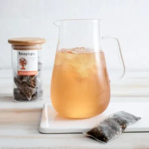 Teapigs Green Tea With Peach, 15 Tea Bags 37.5g, tea brewed into iced peach tea in large clear pitcher, available at teas.co.uk