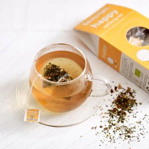 Teapigs Happy Tea With Lemon Balm, 15 Tea Bags 37.5g, tea brewing in glass cup, available at teas.co.uk