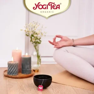 Yogi Tea Organic Alkaline Herbs, 17 Tea Bags 35.7g, lifestyle lady doing yoga drinking tea, available at teas.co.uk